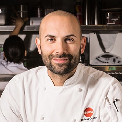 Chef with white uniform smiling